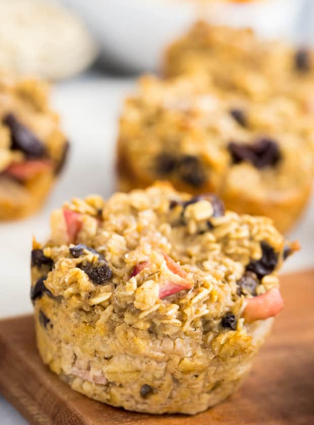 apple oatmeal muffins on a wooden cutting board