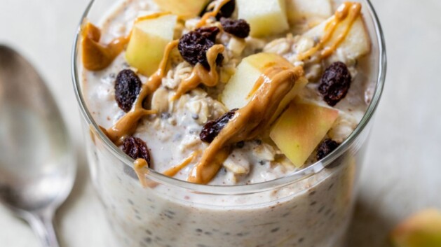 Overnight oats topped with chopped apple, raisins and peanut butter.