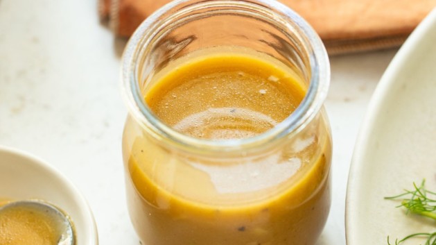 Vinaigrette dressing in a small jar.