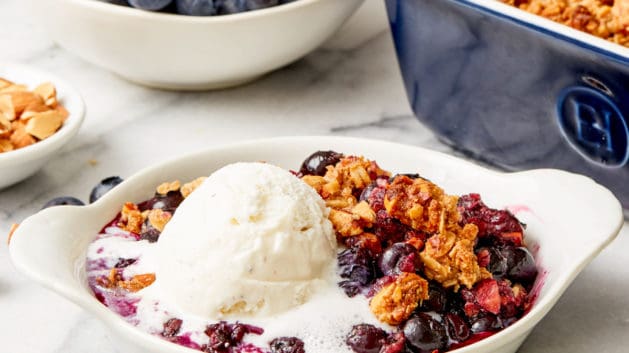 warm blueberry crisp with vanilla ice-cream