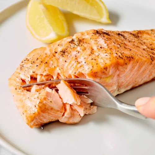 fork cutting into fish