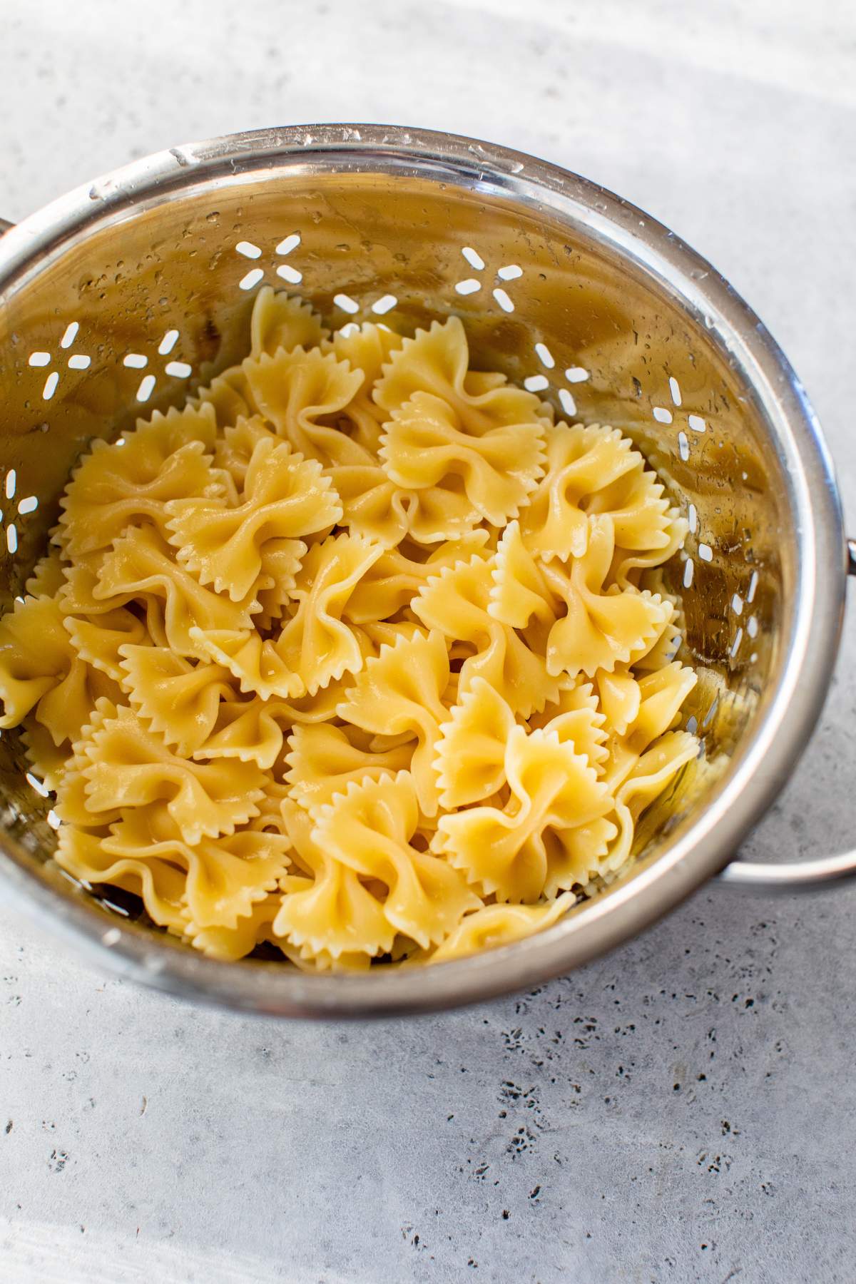 Draining pasta in a colander.