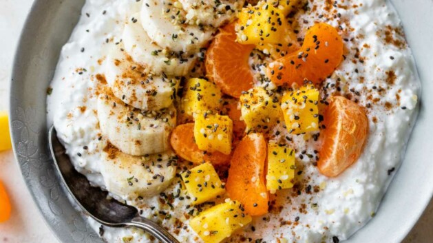 Cottage cheese topped with mango, banana slices, and clementine.