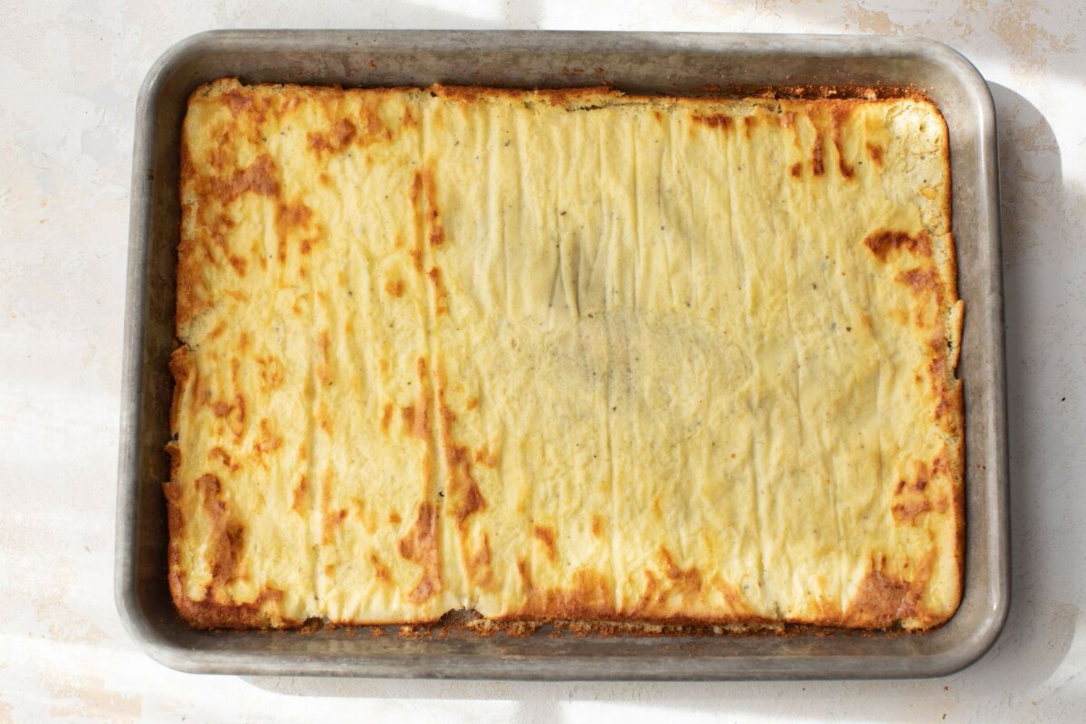Baked cottage cheese flatbread on a pan.