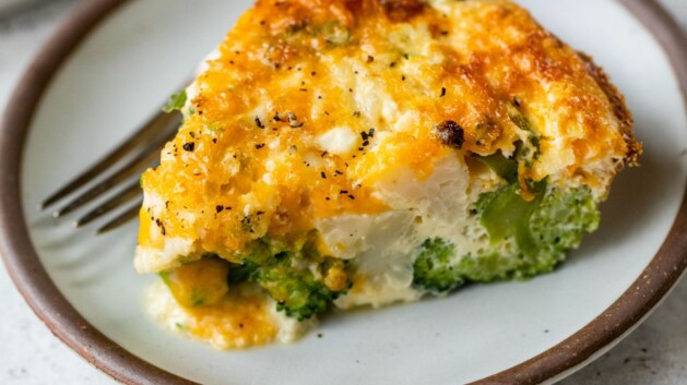 Serving of crustless quiche with broccoli on a plate.