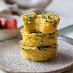 Three egg bites stacked on a plate.