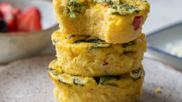 Three egg bites stacked on a plate.