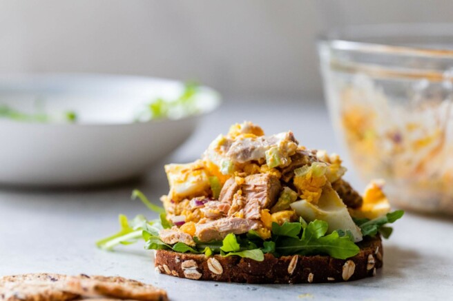 Egg tuna salad served on a slice of bread with lettuce.