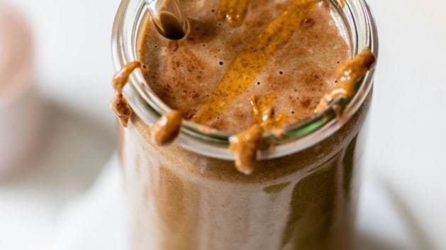 chocolate protein shake topped with almond butter