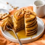 pumpkin protein pancakes being eaten with a fork