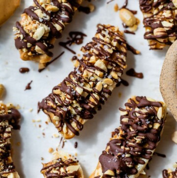 Frozen bananas drizzled with chocolate.