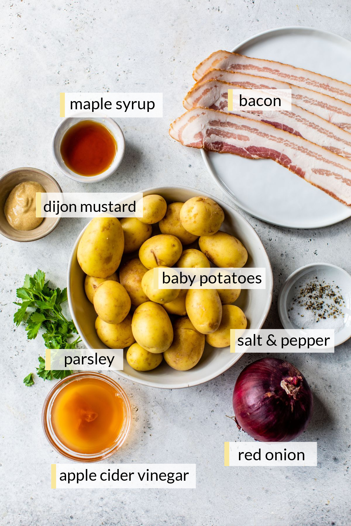 Ingredients for making German potato salad divided into small bowls.