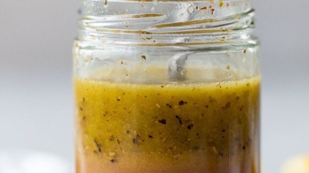 Greek Salad dressing in a glass mason jar.