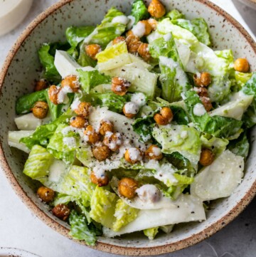 Healthy Caesar salad topped with roasted chickpeas.
