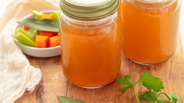 homemade chicken stock stored in mason jars