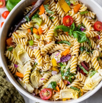 Italian pasta salad in a large white serving bowl.