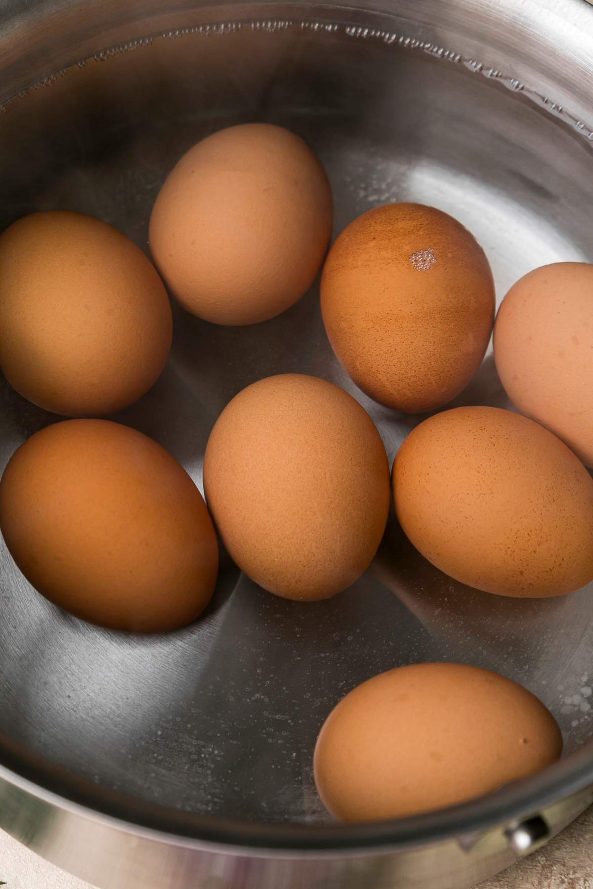 Eggs in a pot of water.