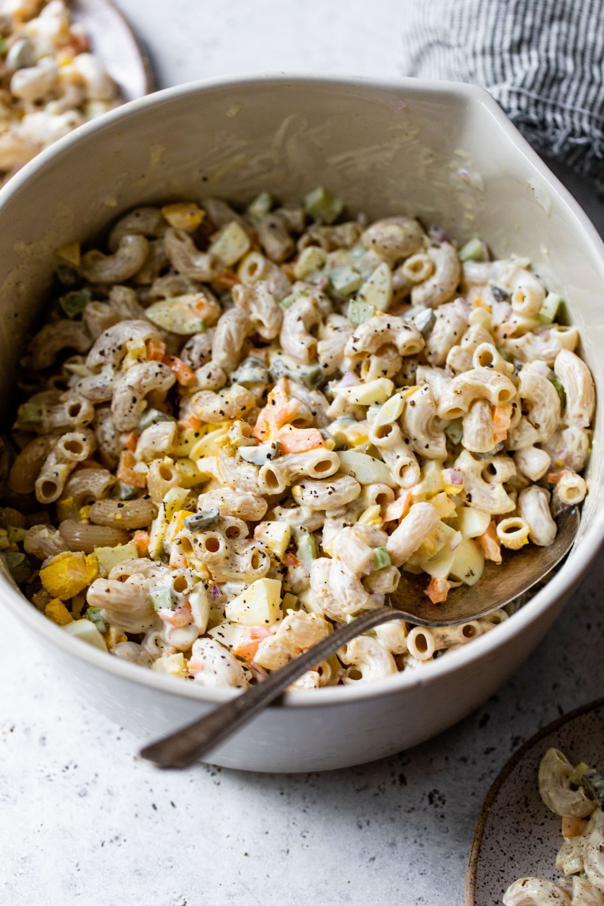 Creamy macaroni salad in a large bowl.