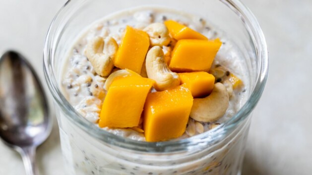 Overnight oats topped mango chunks and cashews.