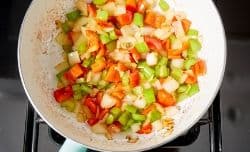 raw veggies cooking in sauté pan
