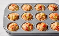 uncooked meatloaf muffins in muffin pan