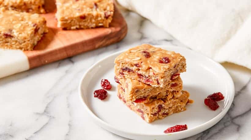 peanut butter oat bars stacked on white plate