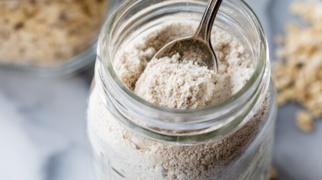 homemade oat flour stored in a glass jar