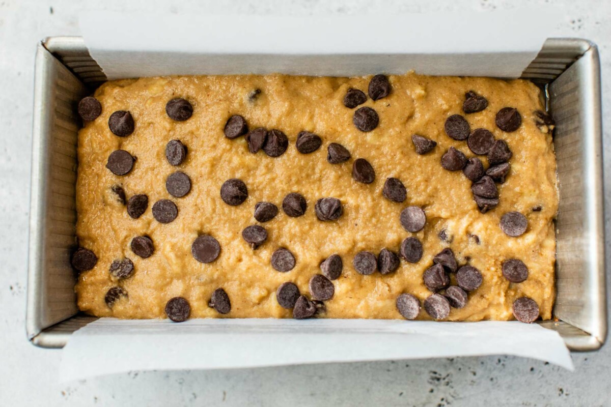 Banana bread batter in a loaf pan.
