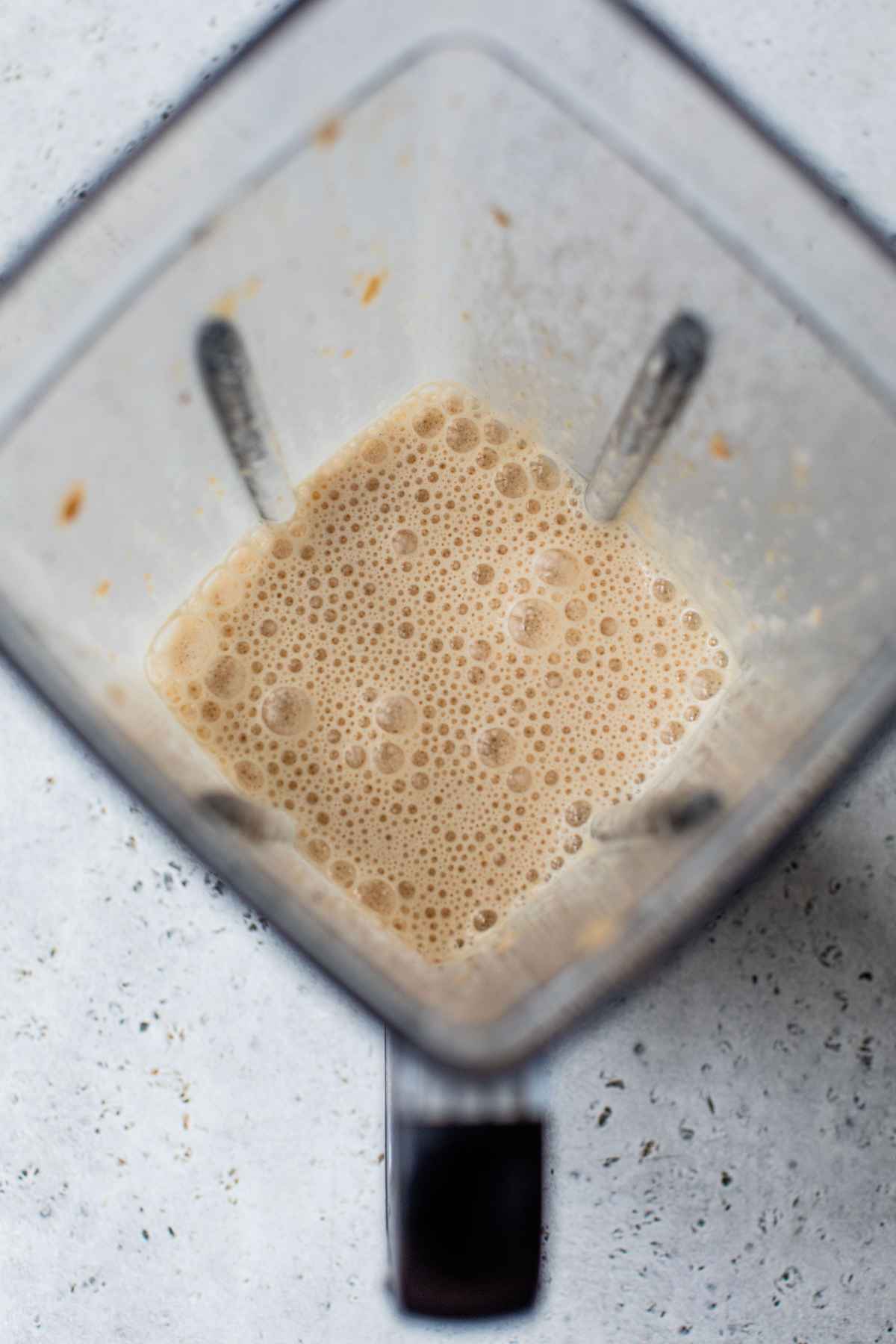Liquid egg mixture blended in a blender.