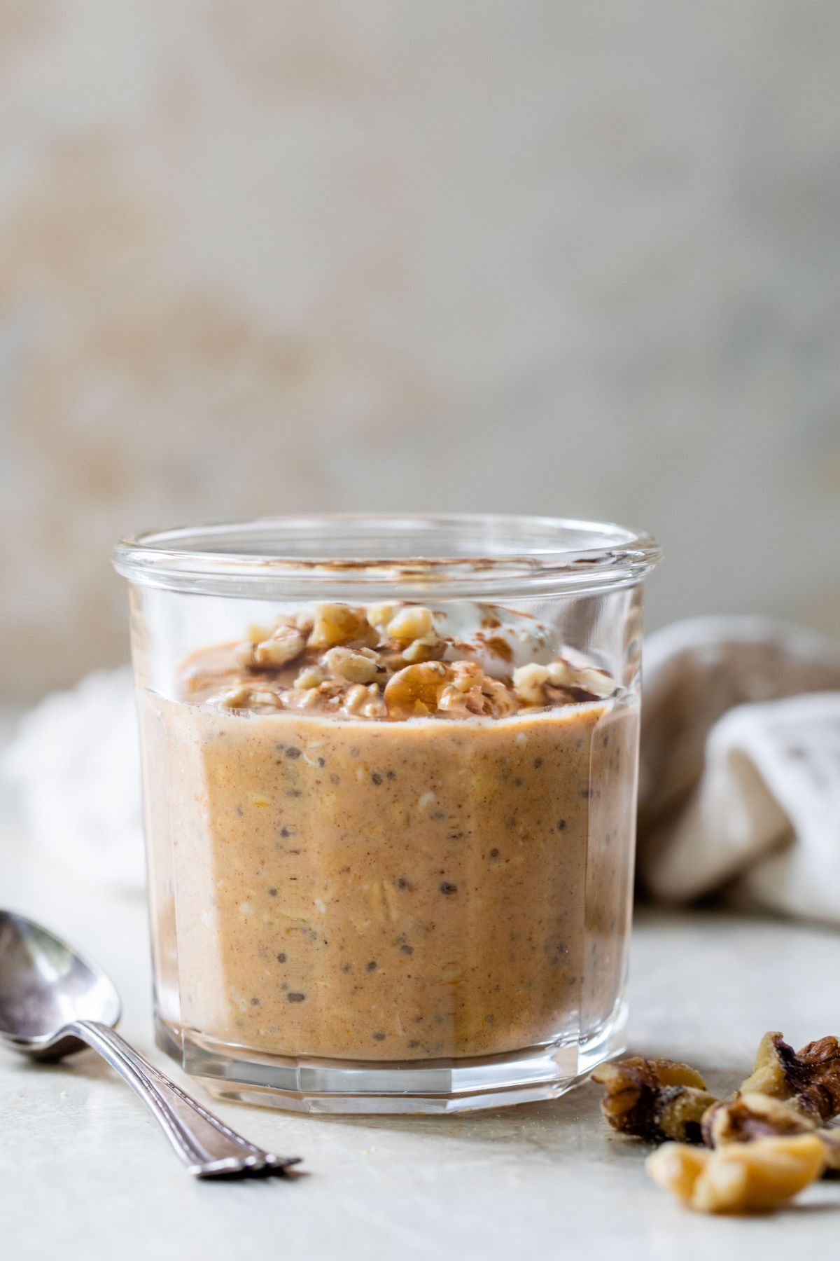 Pumpkin pie overnight oats in a glass jar.