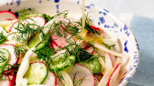 radish salad topped with fresh dill