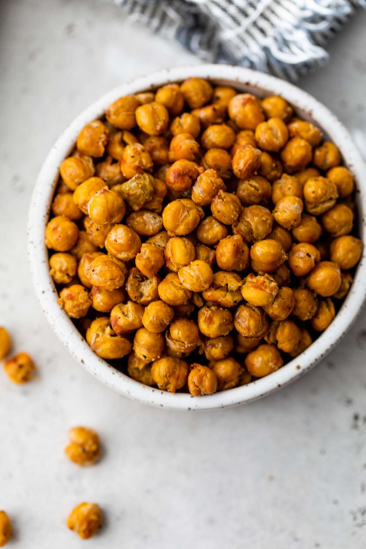 Roasted chickpeas in a small white bowl.