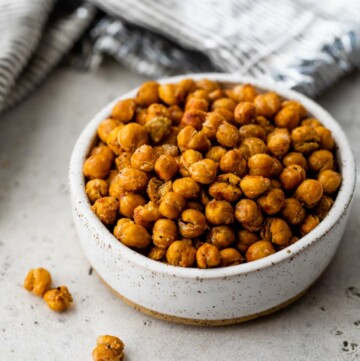 Roasted chickpeas in a small white bowl.
