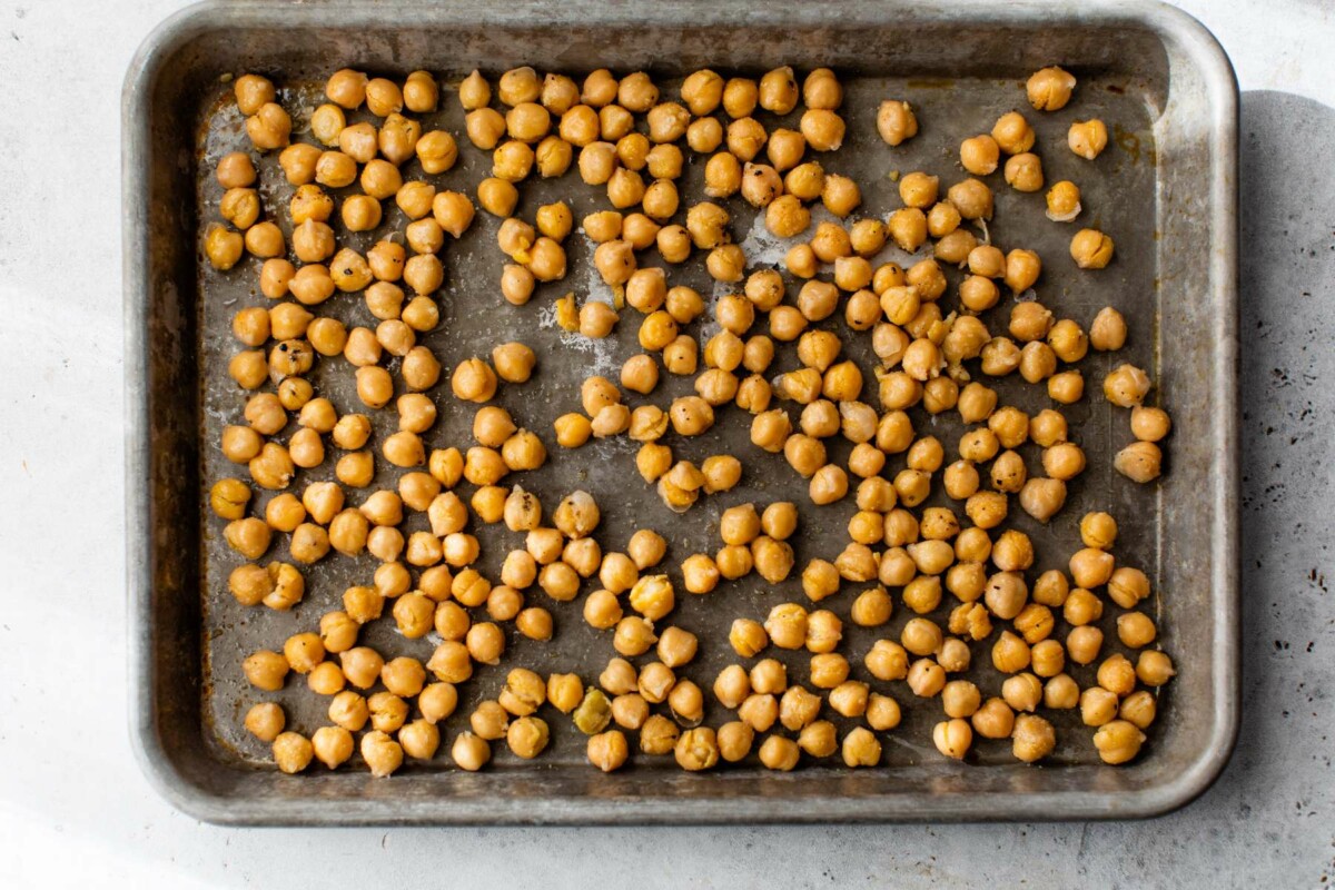 Transfer seasoned chickpeas to a baking sheet pan.