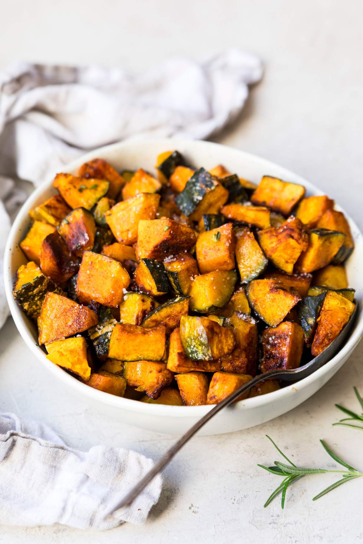 Roasted kabocha squash in a white bowl.