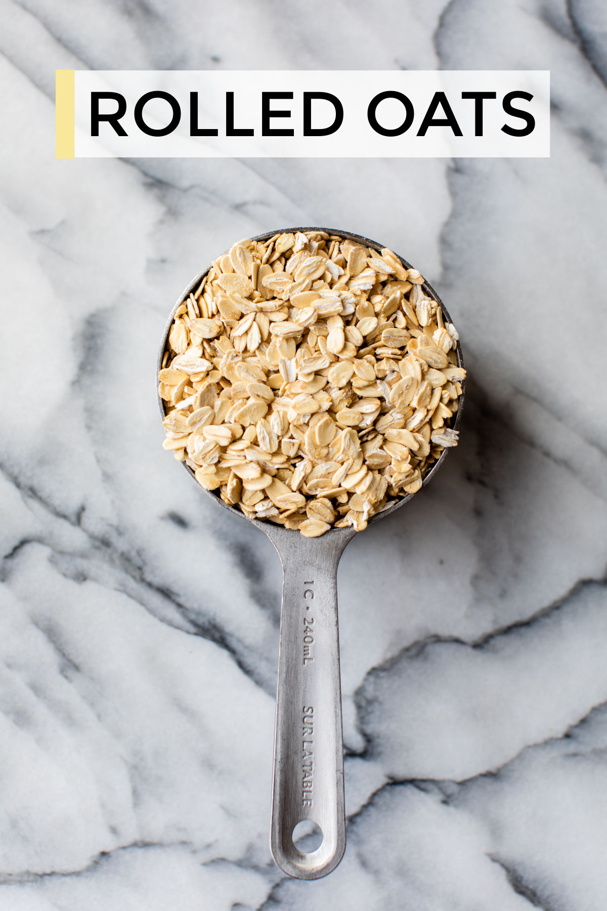 rolled oats in a metal measuring cup