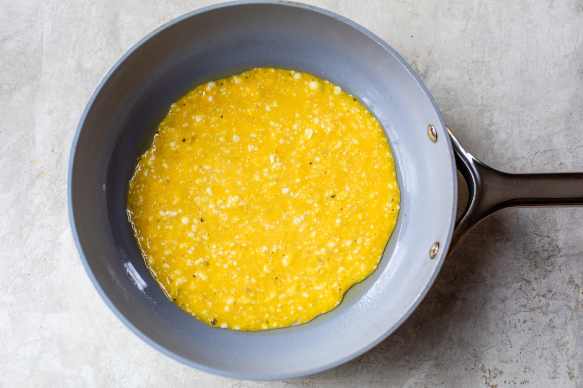 scrambled eggs with cottage cooking in a small saute pan