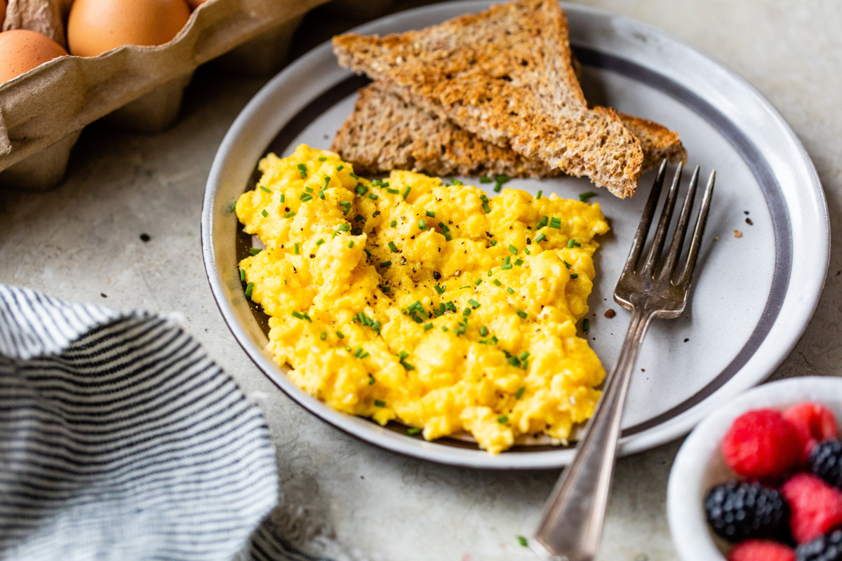 cottage cheese scrambled eggs served with toast and berries