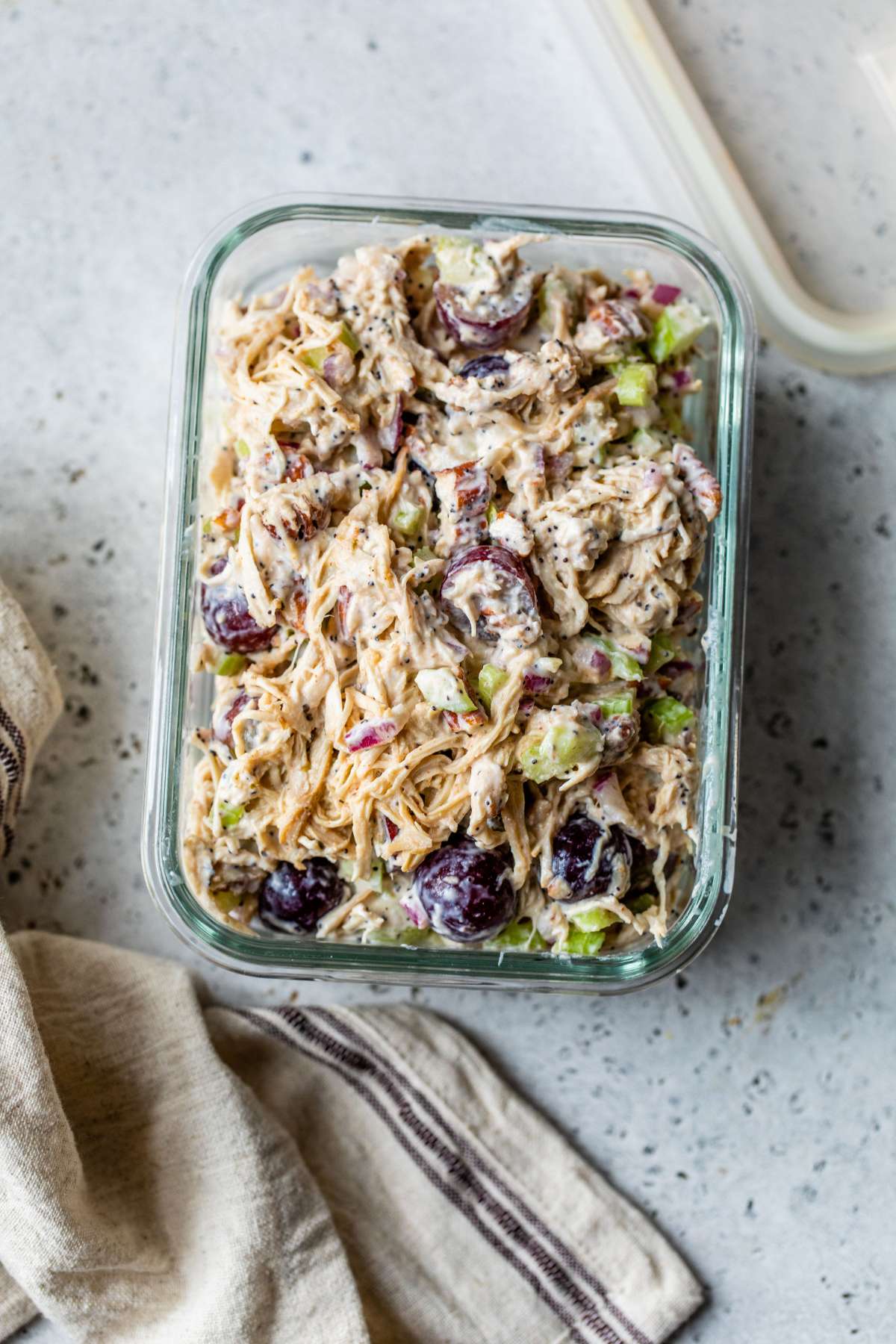 Chicken salad in a glass storage container.