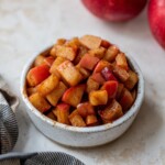 Stovetop cinnamon apples in a small bowl.