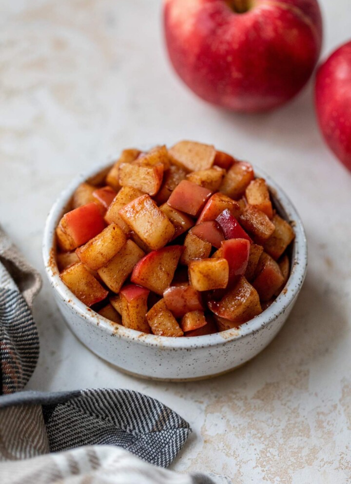 Stovetop cinnamon apples in a small bowl.