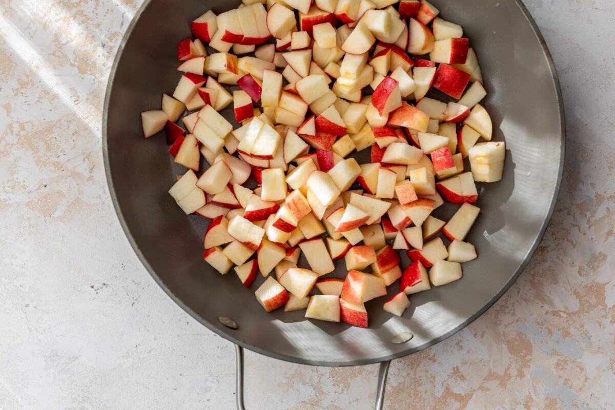 Chopped apples in a skillet.