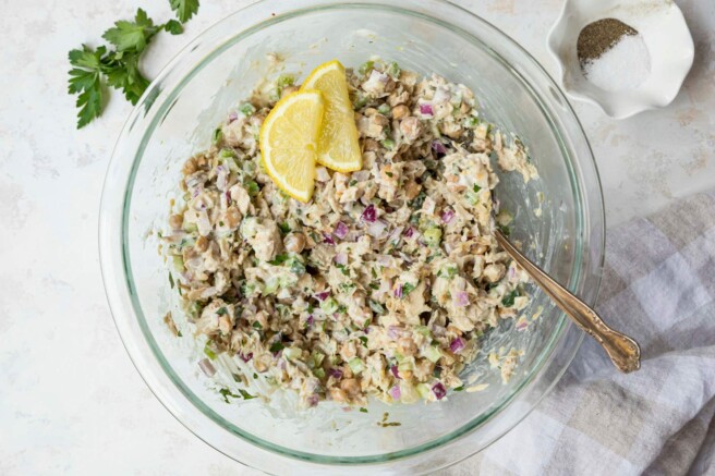 Tuna chickpea salad with lemon slices on top.