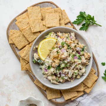Tuna Chickpea Salad served with crackers and lemon slices.