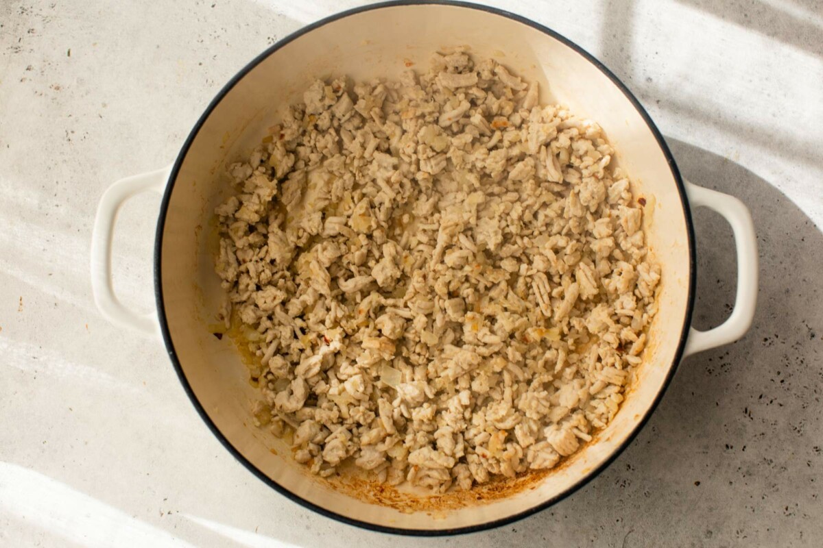 Ground turkey browned in a pot.