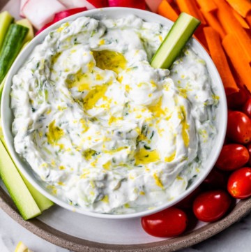 Tzatziki sauce served with fresh-cut veggies.